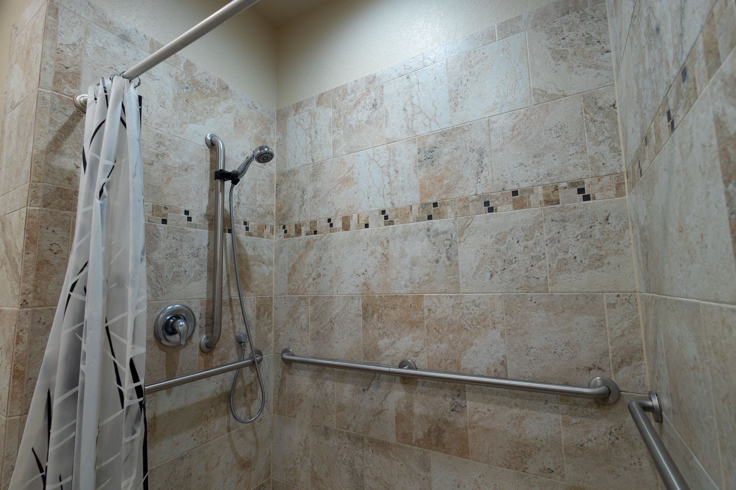 Tiled walk-in shower in a bathhouse